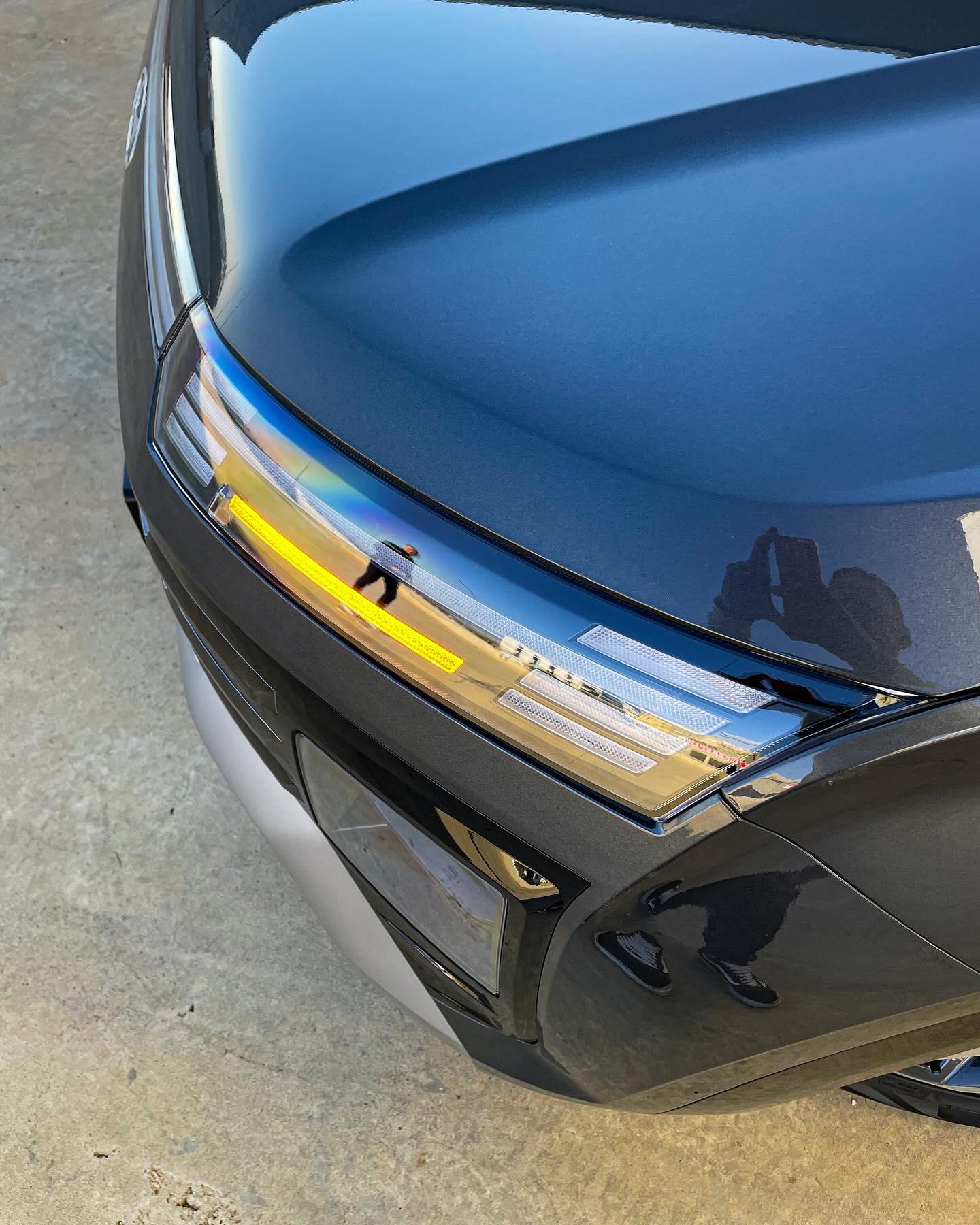 Sleek coupe lines reflecting afternoon warmth